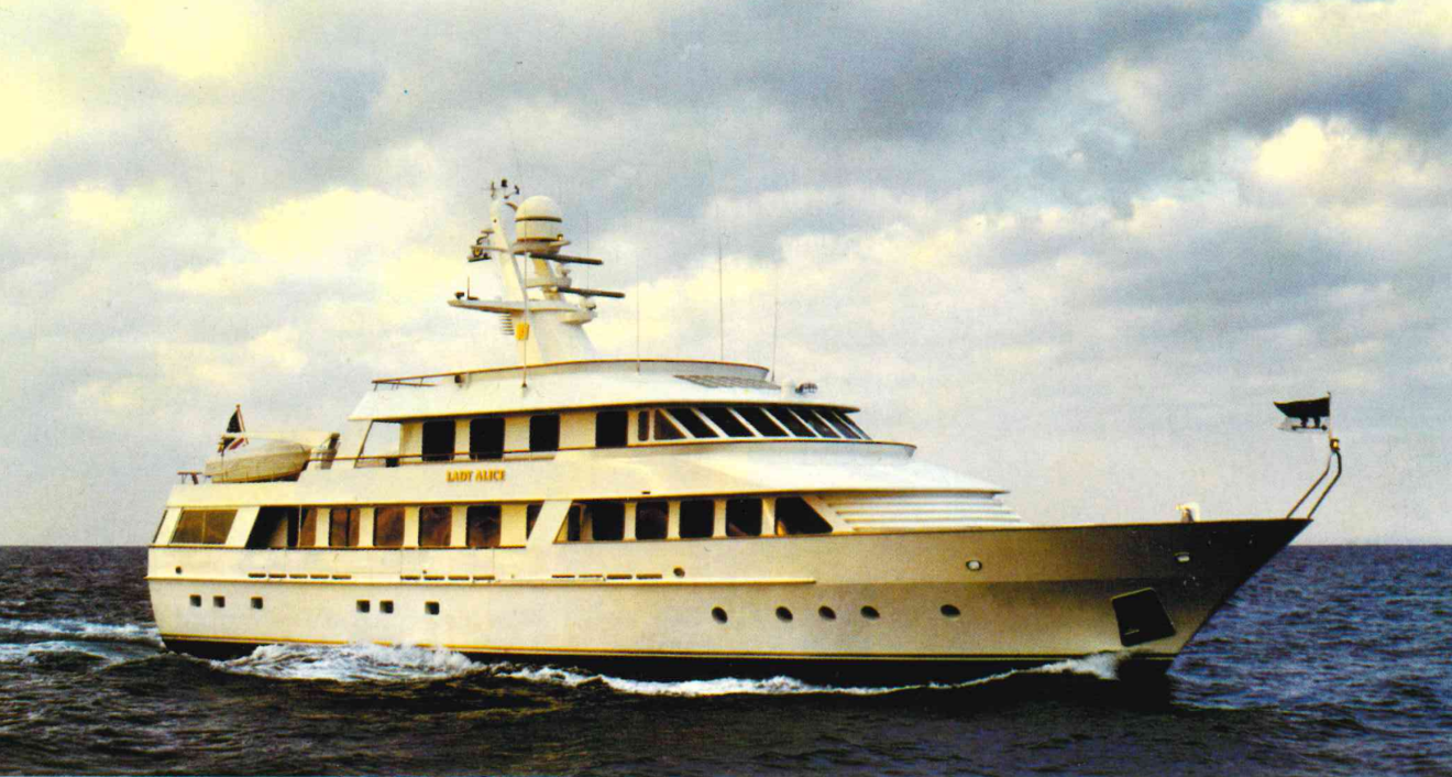 Luxury motor yacht Lady Alice cruising at open sea on calm water under clear sky
